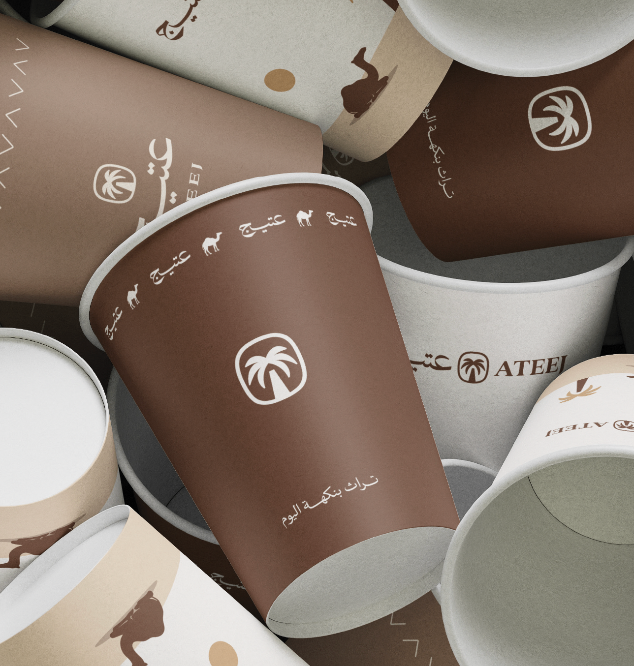 Ateej branded paper cups with palm logo and Arabic calligraphy